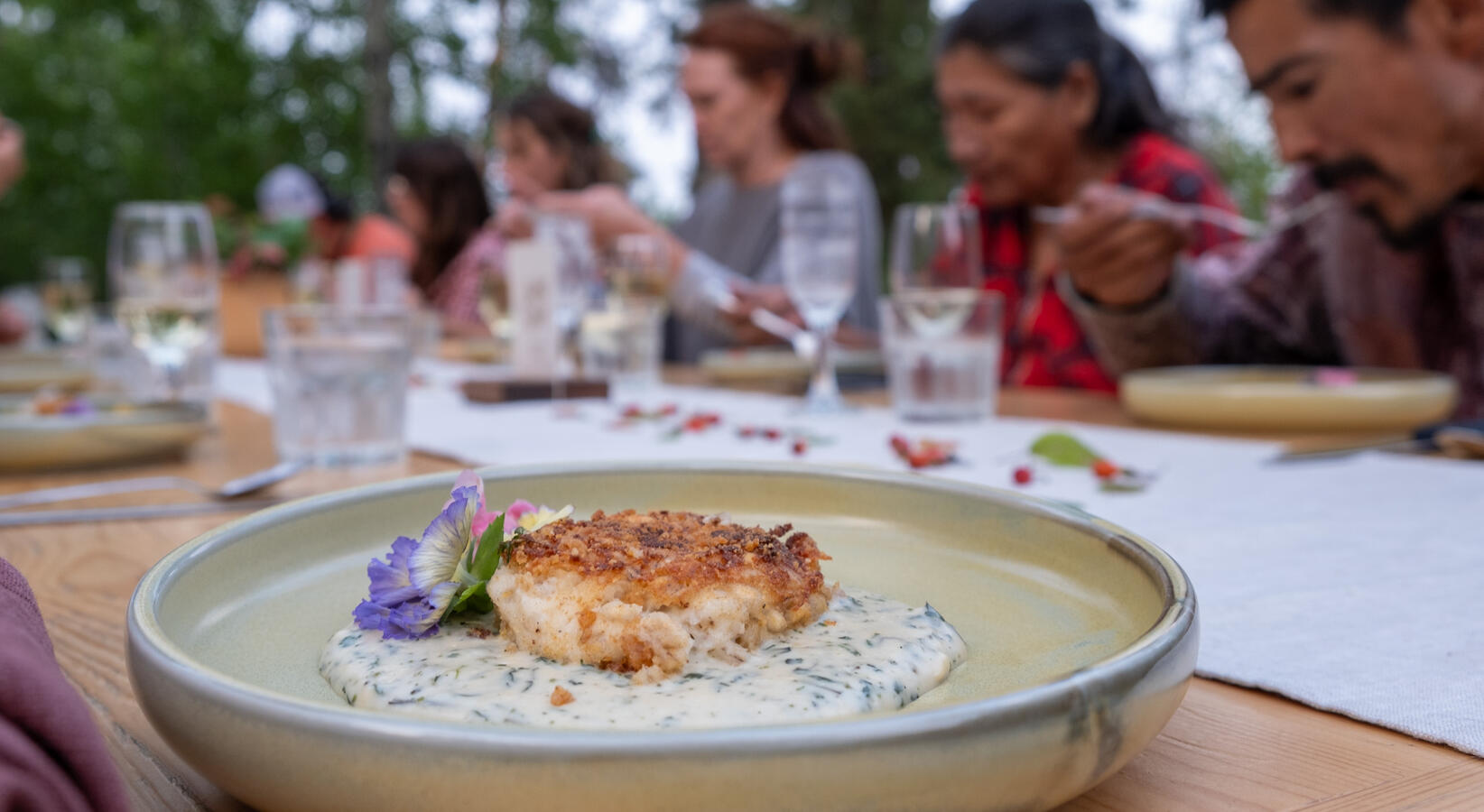 Fish cake at long table dinner