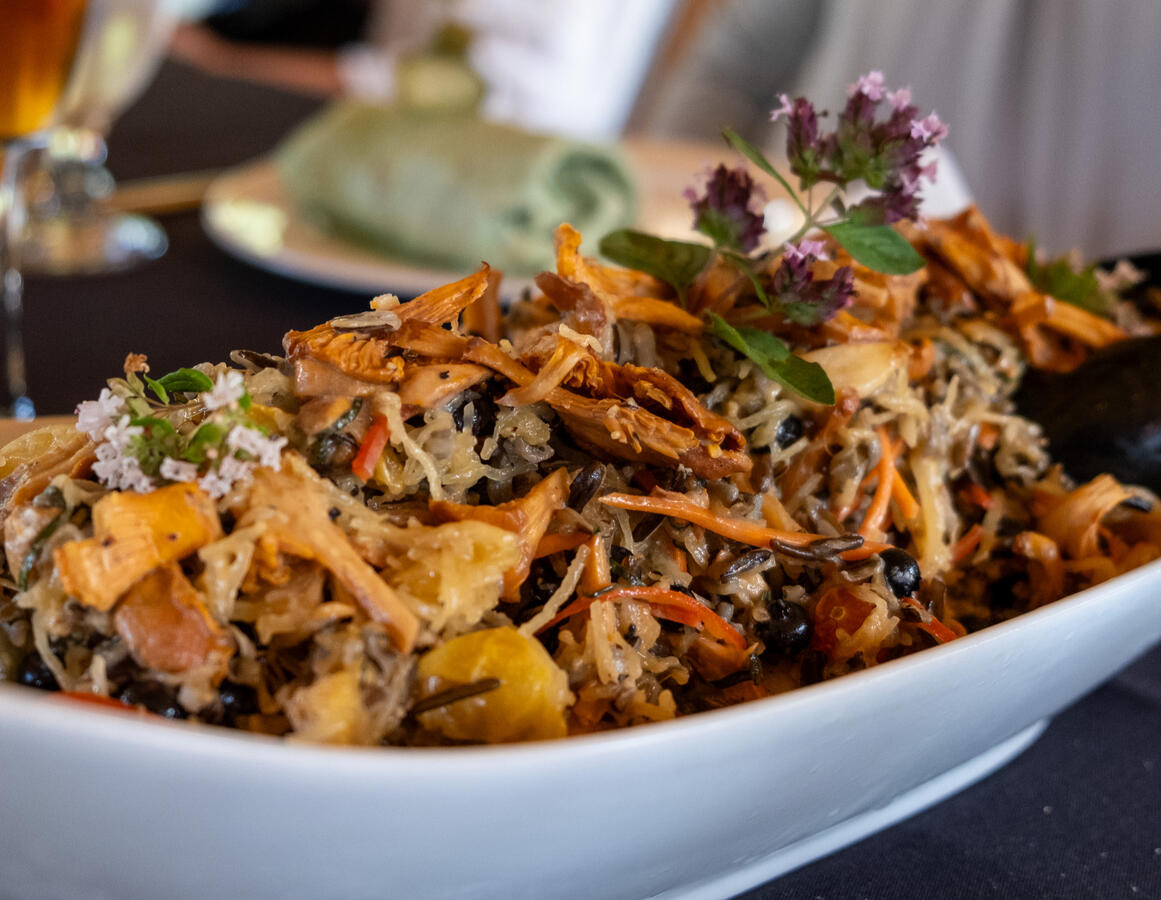 Wild rice with mushrooms and edible flowers